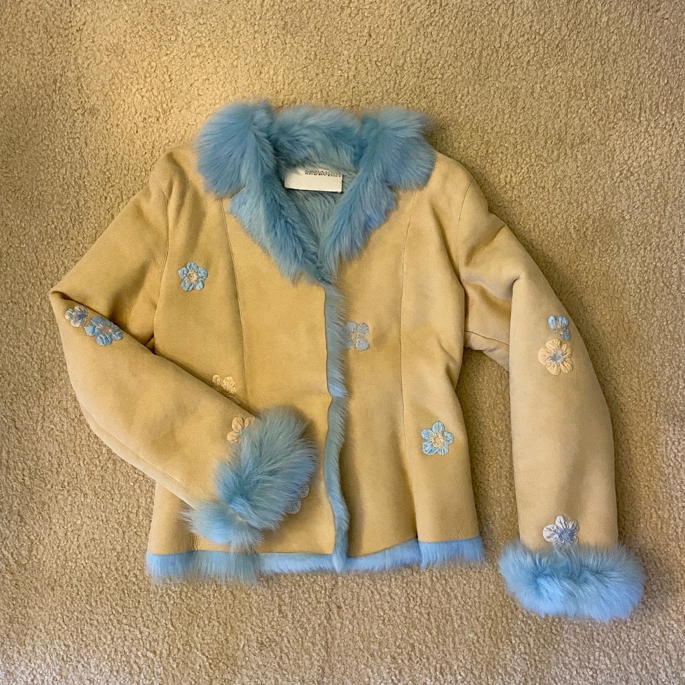 Tan shearling jacket with blue faux fur trim